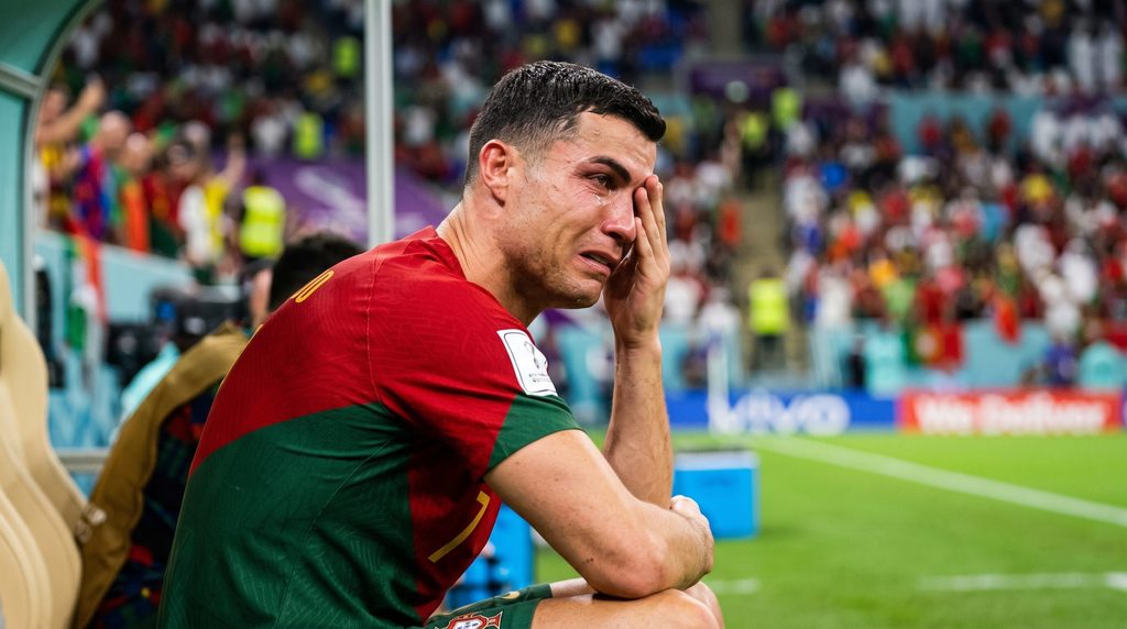 Cristiano ronaldo crying while sitting in the sidelines